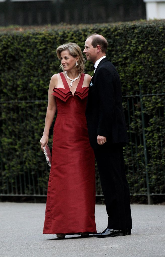 Sophie beside edward in red dress