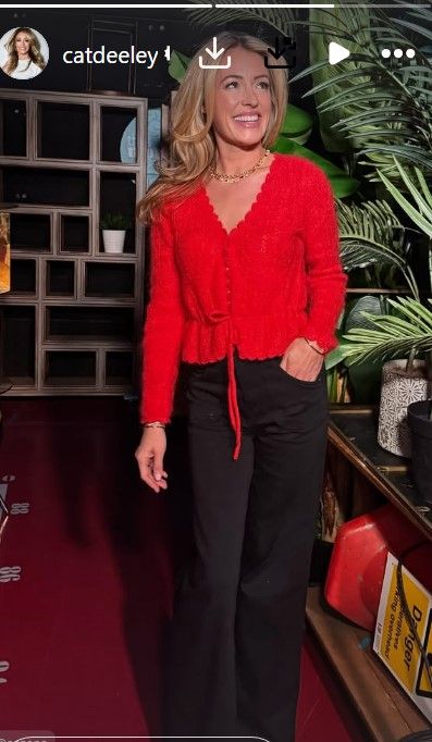Cat looked incredible in her stunning red top and wide jeans combo