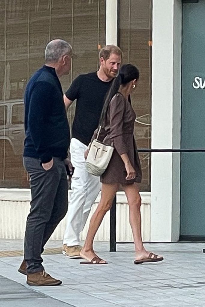 Meghan  Markle earing Hermes slides to a sushi date with Prince Harry