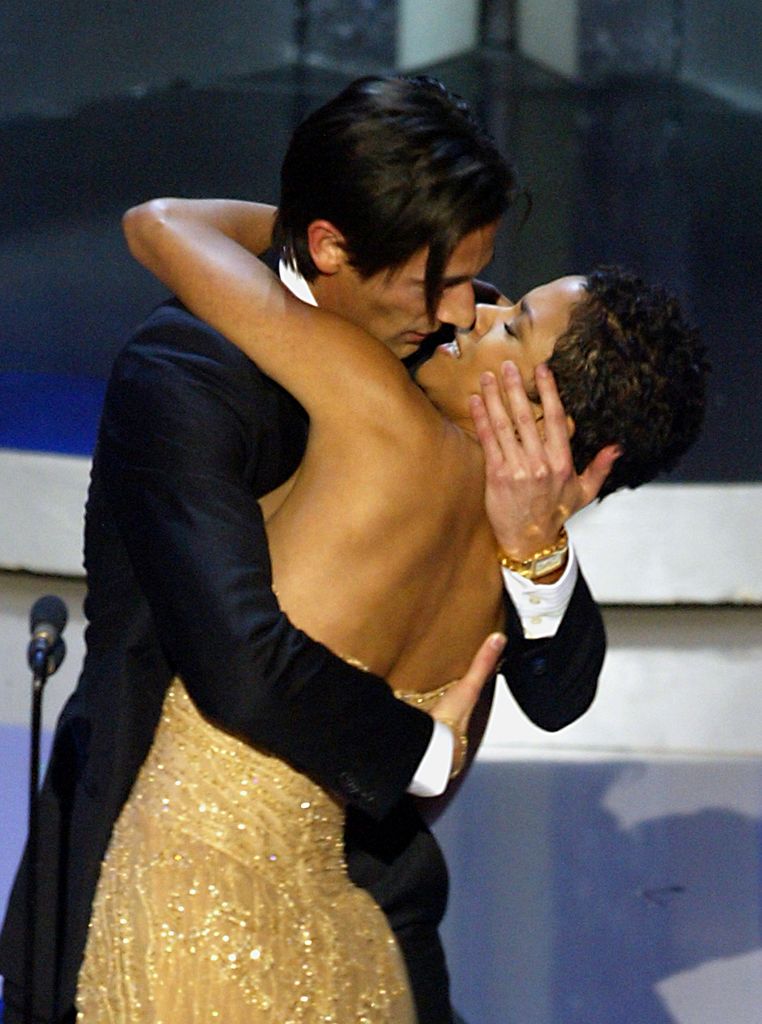 Actor Adrien Brody kissing presenter Halle Berry after he won the Oscar for best actor in 2003