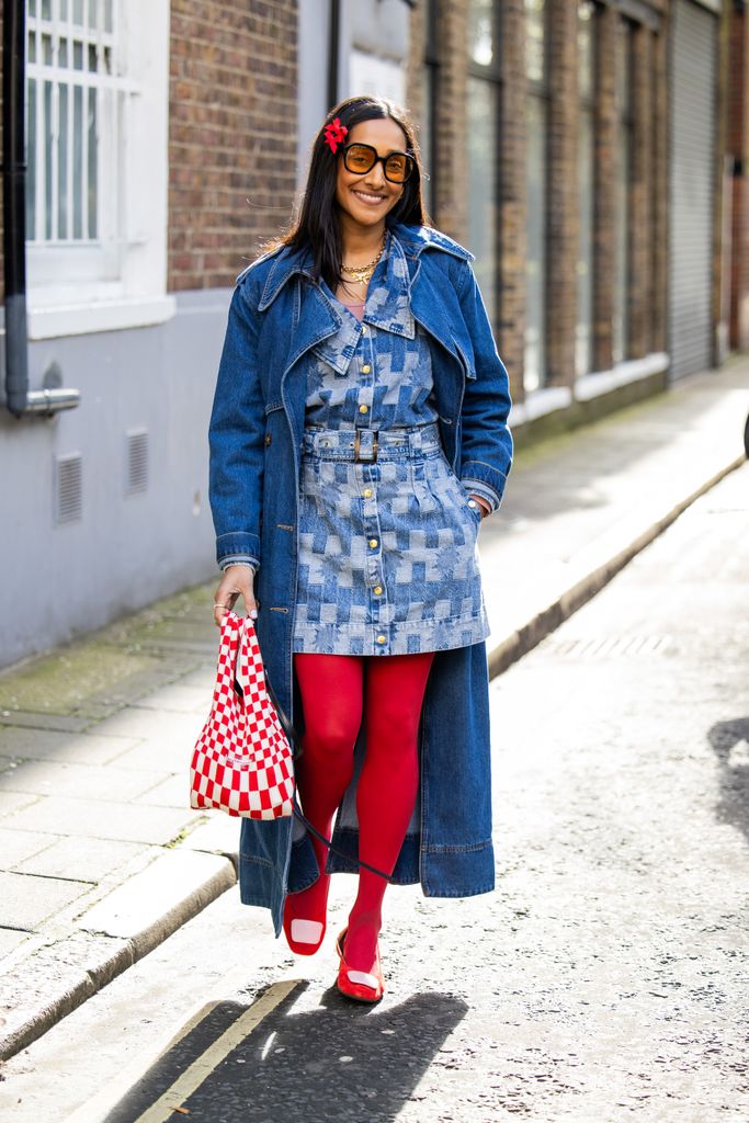 Serial dopamine dresser Zeena donned red tights, a red checkered bag, a denim outfit, and red hair accessories outside Bora Aksu.