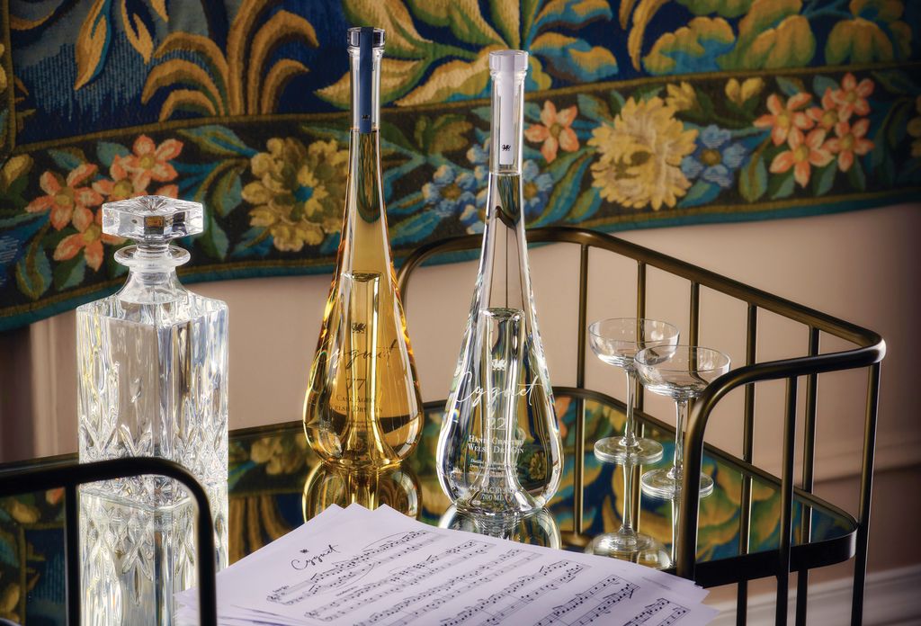 A bottle of Cygnet 22 and 77 as well as a pair of martini and rocks glasses by Erik Lorincz 