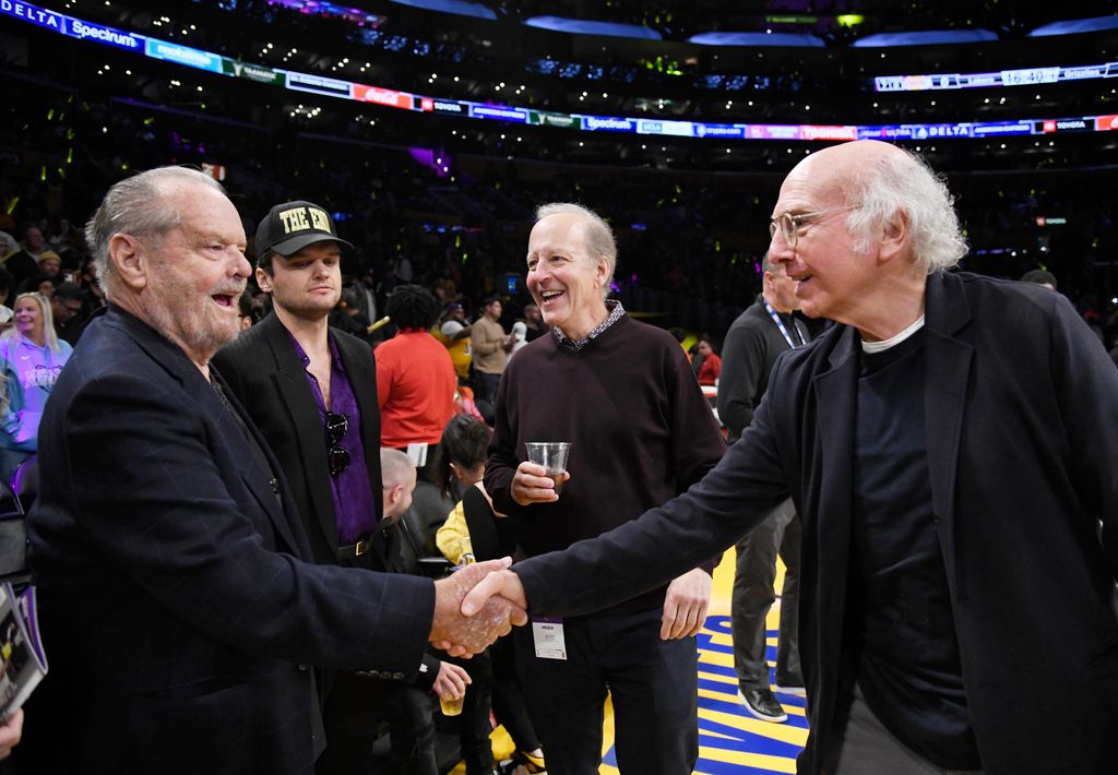 Jack Nicholson greets Larry David at the last Lakers game he attended on April 28