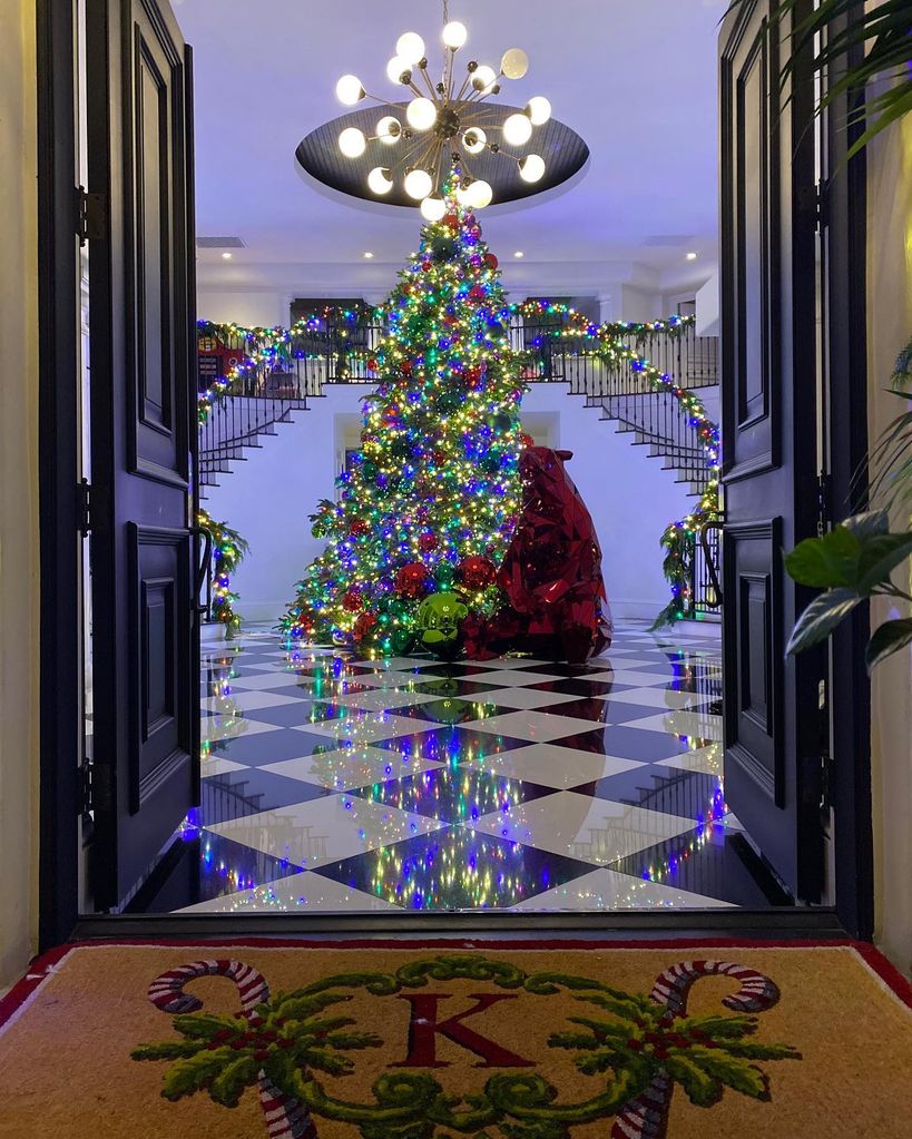 Rob kardashian's grand entryway decorated with christmas tree