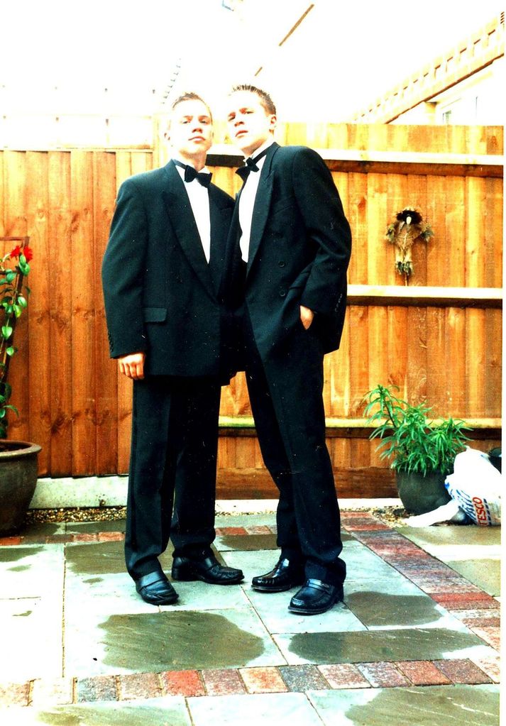 Olly Murs and his twin brother in tuxedos