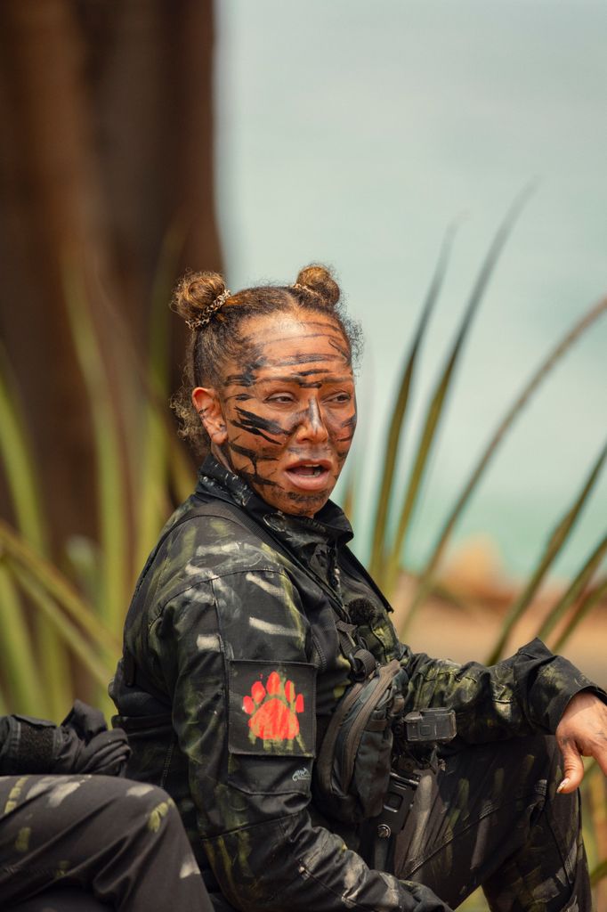 Woman wearing face paint with hair tied up