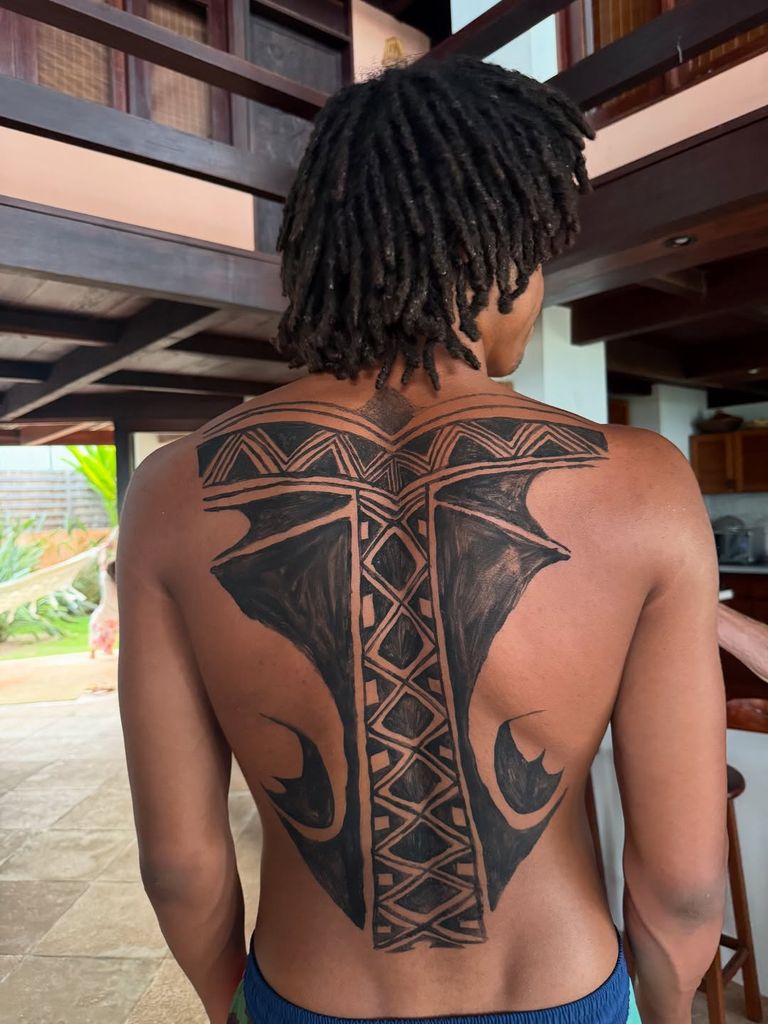 Henry Samuel shows off the body art he received on his back in Brazil, shared on Instagram