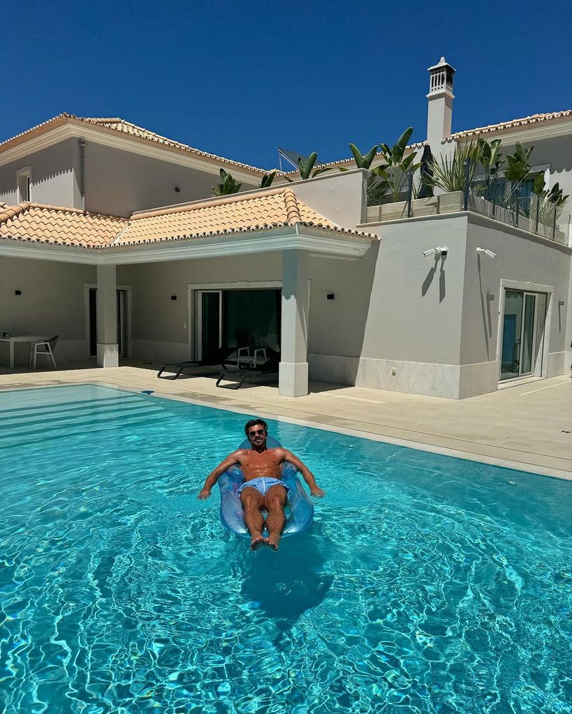 Jack Grealish in an inflatable in the pool