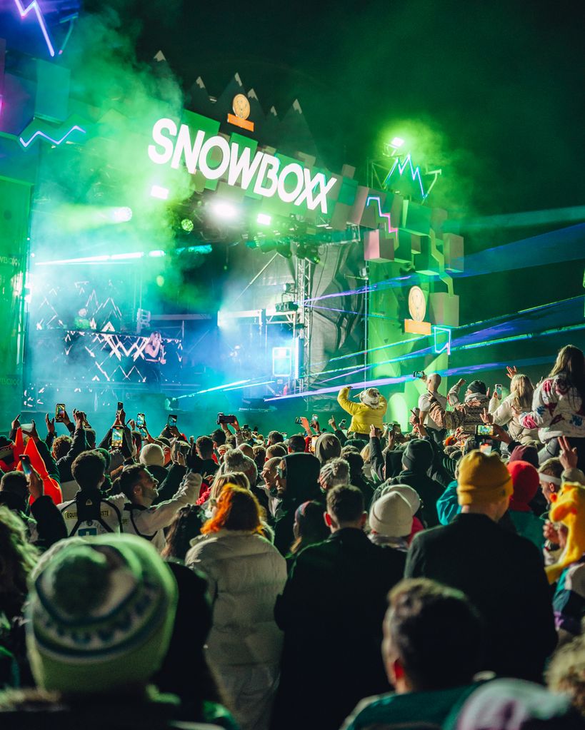 Guests dancing at Snowboxx festival at night