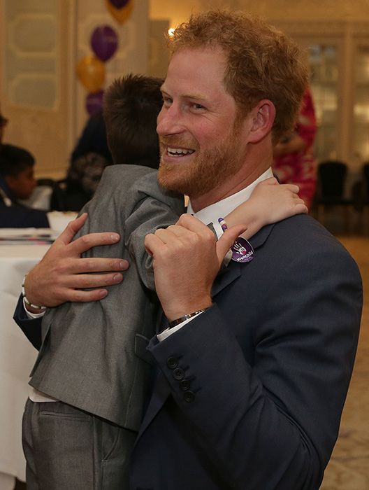Prince Harry hugged by Ollie Carroll at WellChild Awards