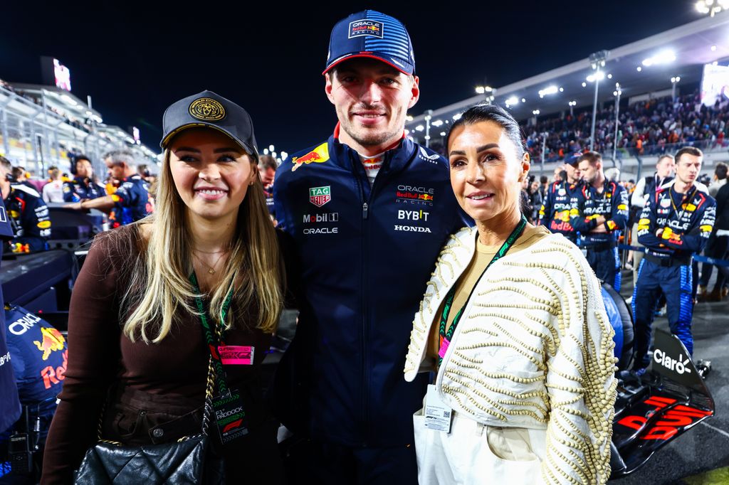 Max Verstappen with his arms around his sister and mother