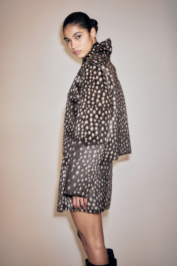 model in fawn print jacket