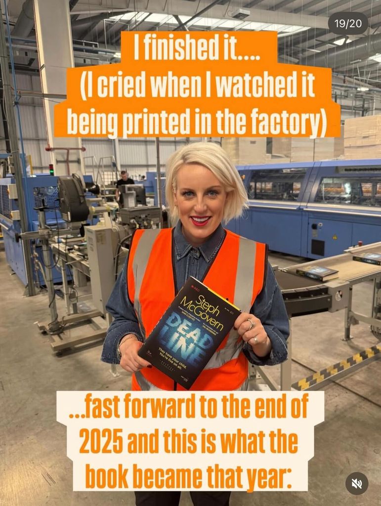 Steph mcgovern in high vis holding book in factory