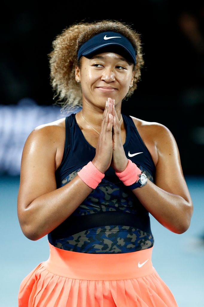 naomi osaka celebrating win on court 