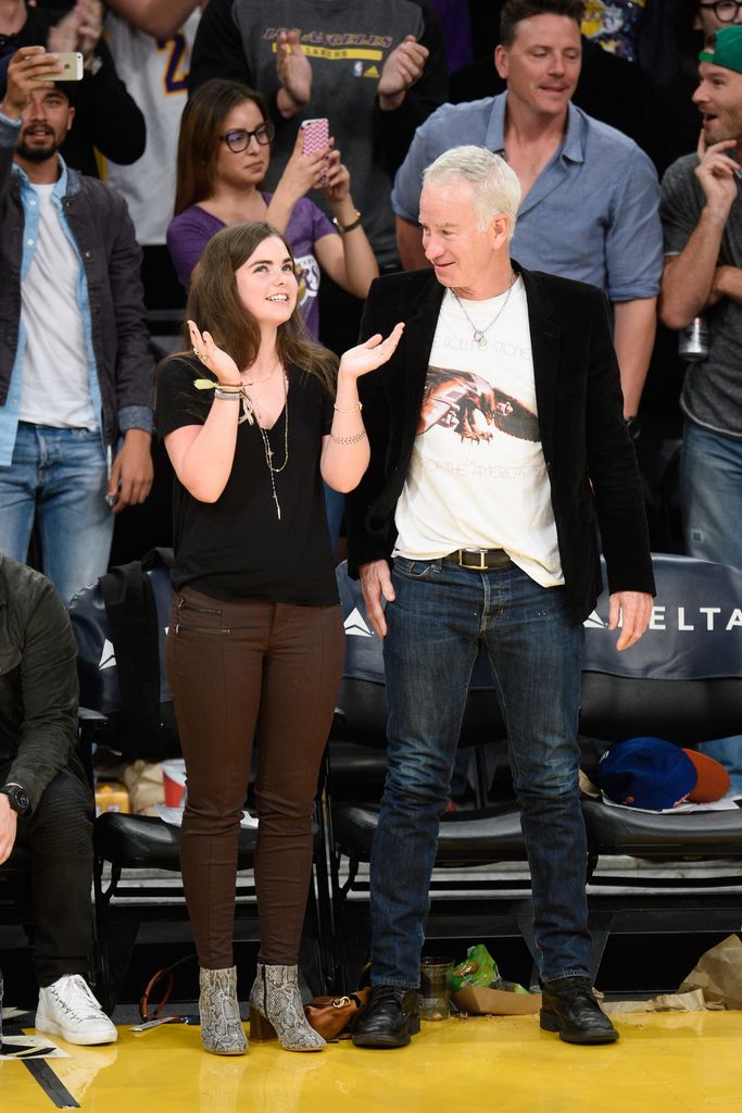 Ava and John McEnroe at a basketball game 