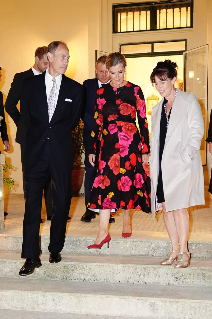 The Duchess of Edinburgh in ruby slippers and red rose dress