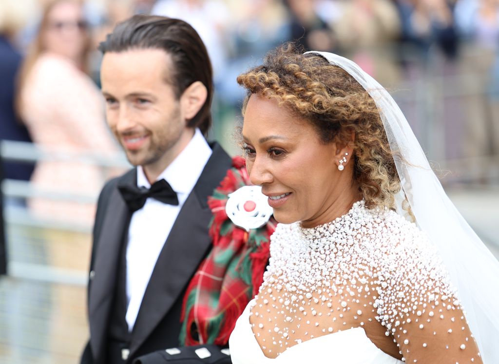 Melanie Brown in pearl bridal gown and her husband hairdresser Rory McPhee