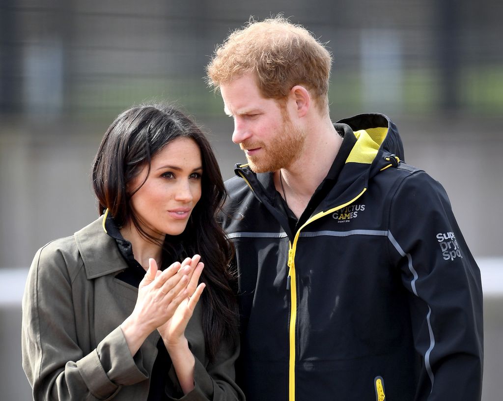 prince harry and meghan markle chatting 