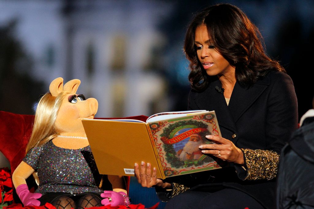 First Lady Michelle Obama and Muppet Miss Piggy read 'Twas the Night Before Christmas' to children at the 93rd Annual National Christmas Tree Lighting at The Ellipse on December 3, 2015 in Washington, DC