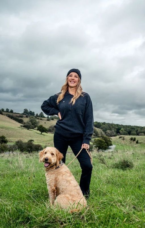 Ellie Goulding in a field with a dog