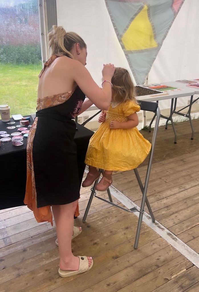 Carrie Johnson's daughter Romy having her face painted