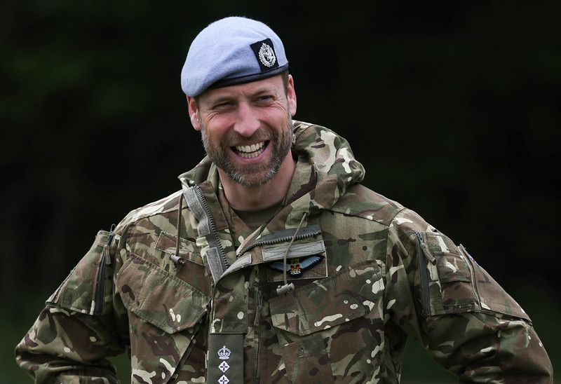 prince william smiling in military clothing and beret