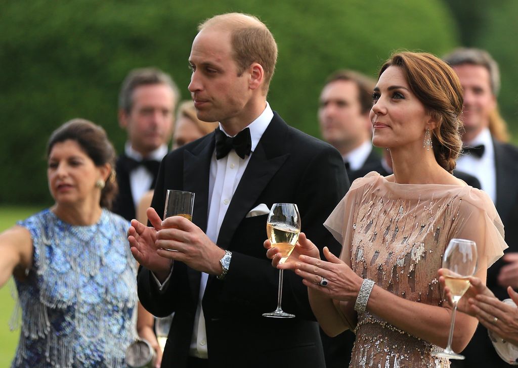 kate and william at houghton hall holding champagne 