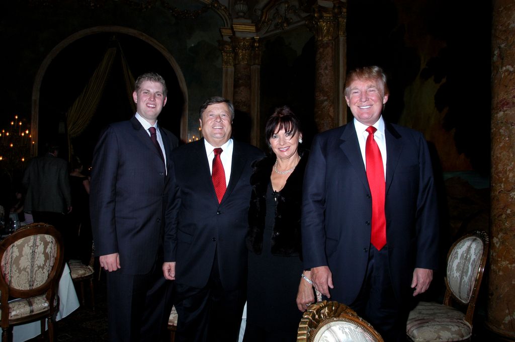 Group portrait of, from left, Eric Trump, his step grandparents, Viktor and Amalija Knavs, and his father, real estate developer Donald Trump, as they pose together at the Mar-a-Lago estate, Palm Beach, Florida, October 24, 2006