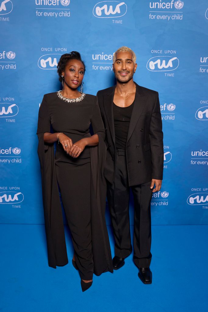 Scarlette Douglas in a dress with an embellished neckline and Lee Juggurnauth in a suit