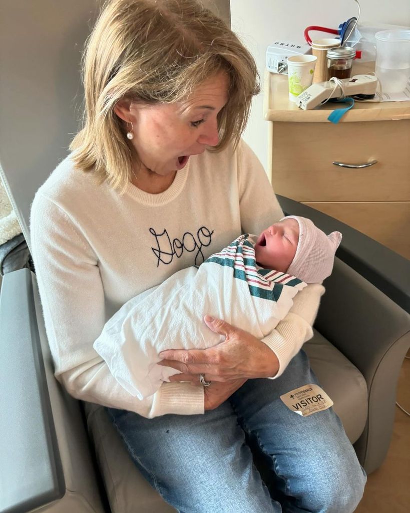 Katie Couric holding her newborn grandson John Albert Dobrosky