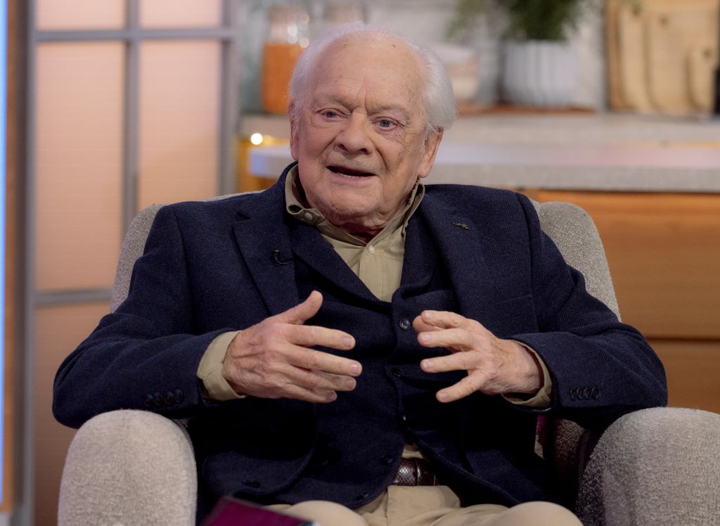 Sir David Jason sitting in a chair