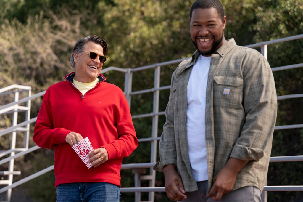 two men standing outdoors 