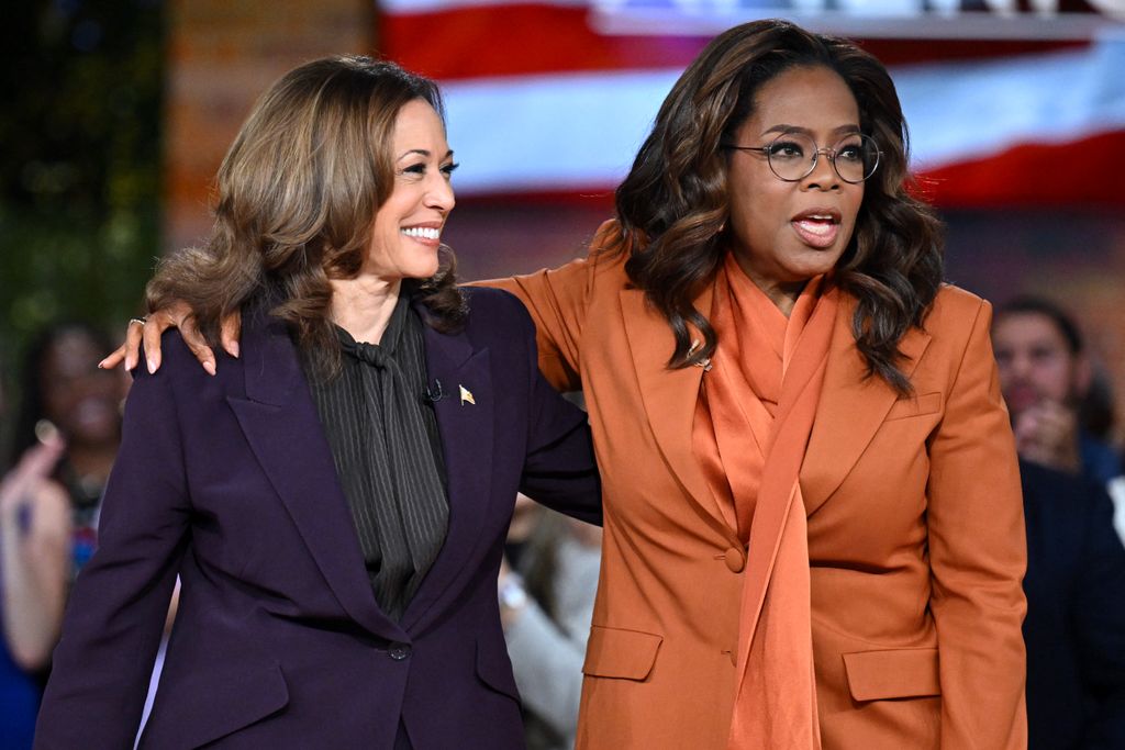 Kamala Harris (L) joins US television producer Oprah Winfrey at a 'Unite for America' live streaming rally in Farmington Hills, Michigan, on September 19, 2024