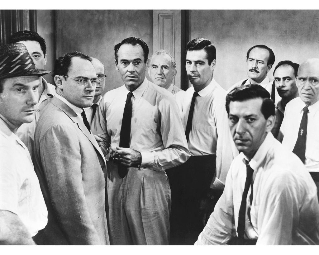 A scene from the film '12 Angry Men', 1957. From left to right, actors Jack Warden, Edward Binns, E. G. Marshall, John Fiedler, Henry Fonda, Ed Begley, Robert Webber, Jack Klugman (foreground), George Voskovec, Martin Balsam and Joseph Sweeney.   
