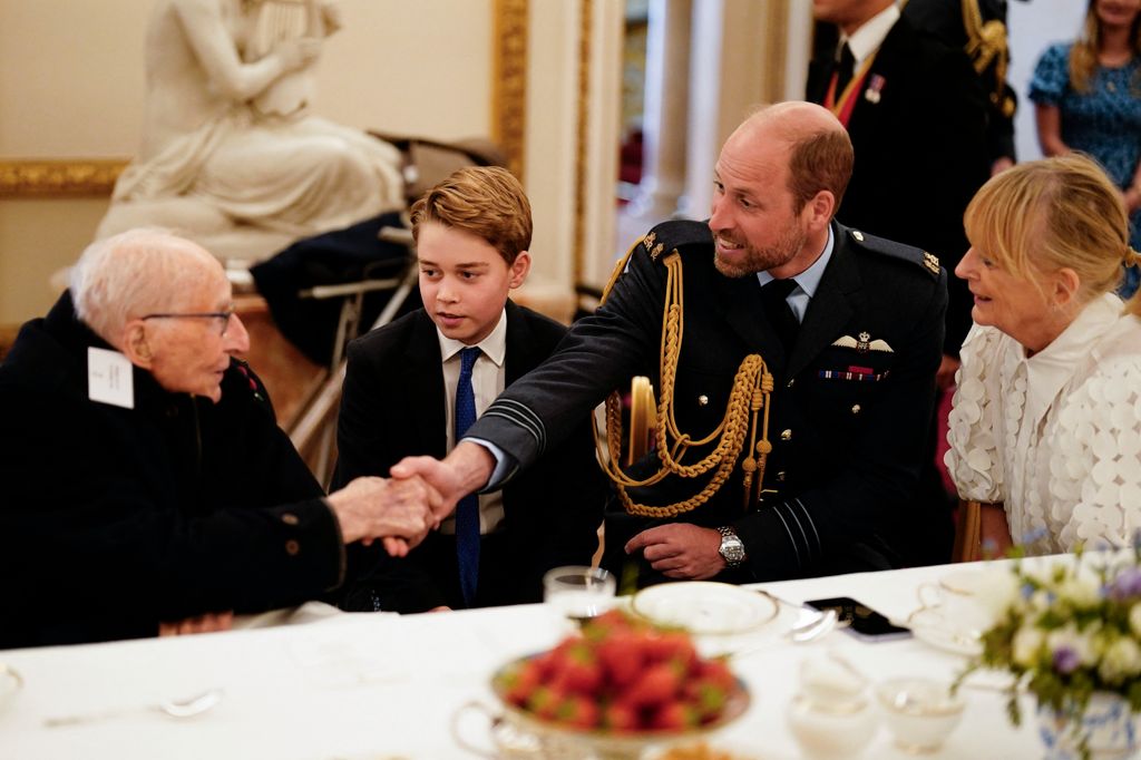 William shaking hands with veteran