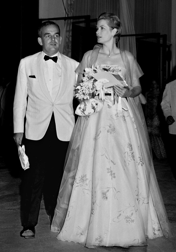 Princess Grace and her husband Prince Rainier of Monaco arrive 19 July 1958 at Monaco Sporting Club