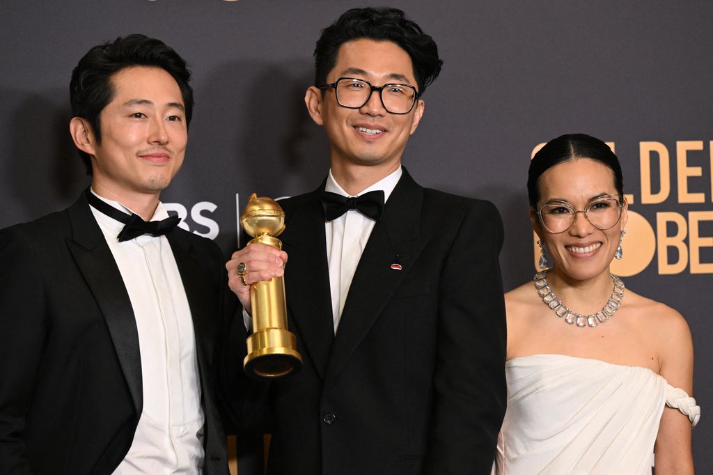 Steven Yeun, South Korean writer Lee Sung Jin, and Ali Wong, winners for Beef, pose in the press room