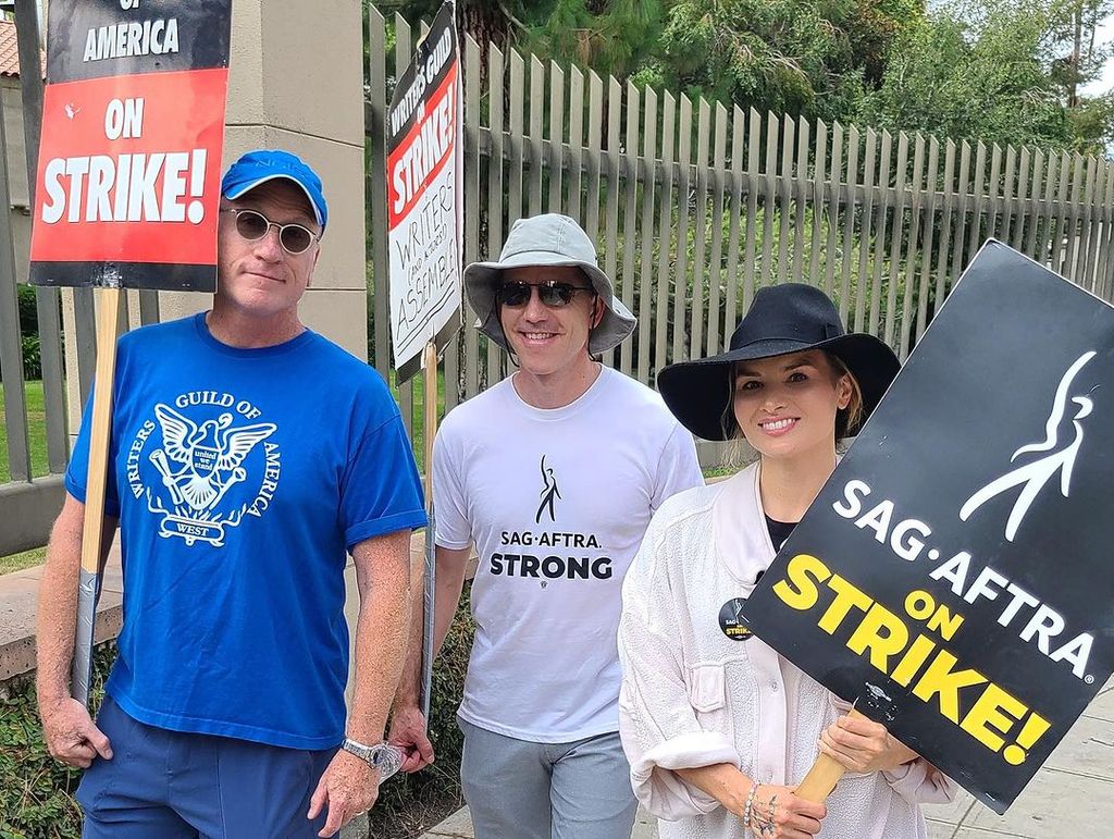 Brian Dietzen and Katrina Law on the picket lines