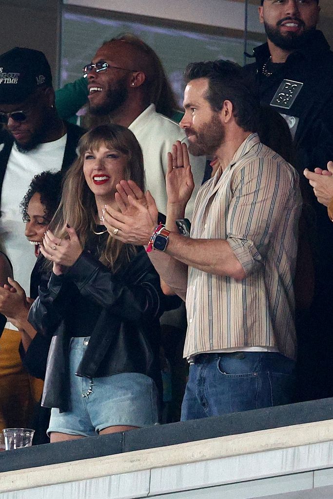 Singer Taylor Swift and Actor Ryan Reynolds cheer prior to the game between the Kansas City Chiefs and the New York Jets at MetLife Stadium on October 01, 2023 in East Rutherford, New Jersey. (Photo by Elsa/Getty Images)