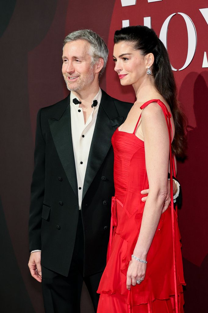 Adam Shulman and Anne Hathaway attend the 2025 WWD Honors at Cipriani South Street on October 28, 2025 in New York City. (Photo by Theo Wargo/Getty Images)