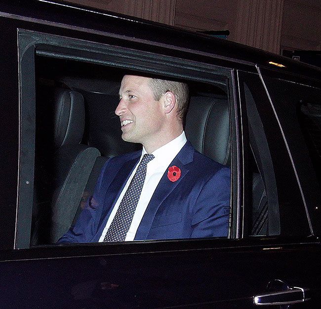 Prince William smiling inside his car after leaving Oswalds