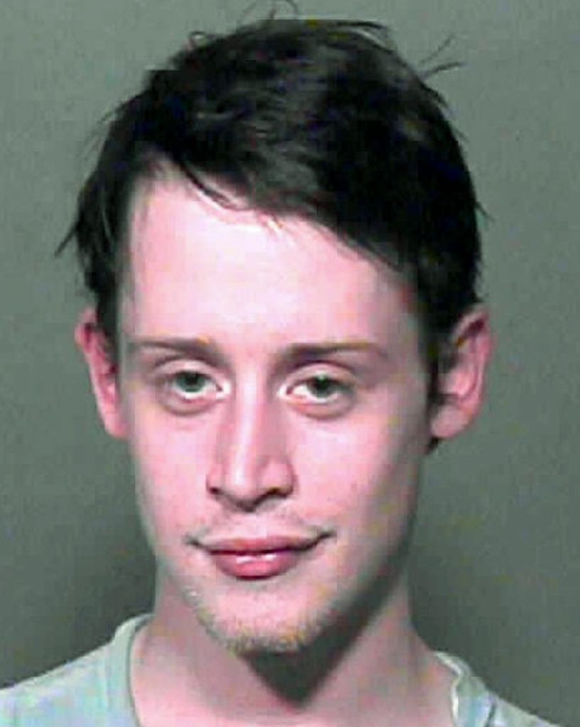 Macaulay Culkin in a mug shot