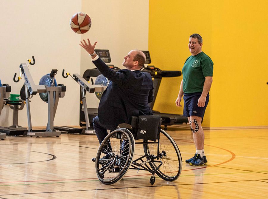 prince william playing wheelchair basketball centre