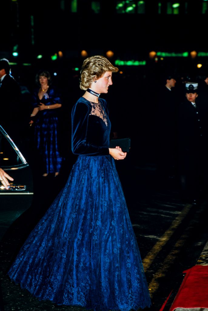 Diana, Princess of Wales in 1985 wearing a blue velvet jacket with lace detail and a full blue skirt