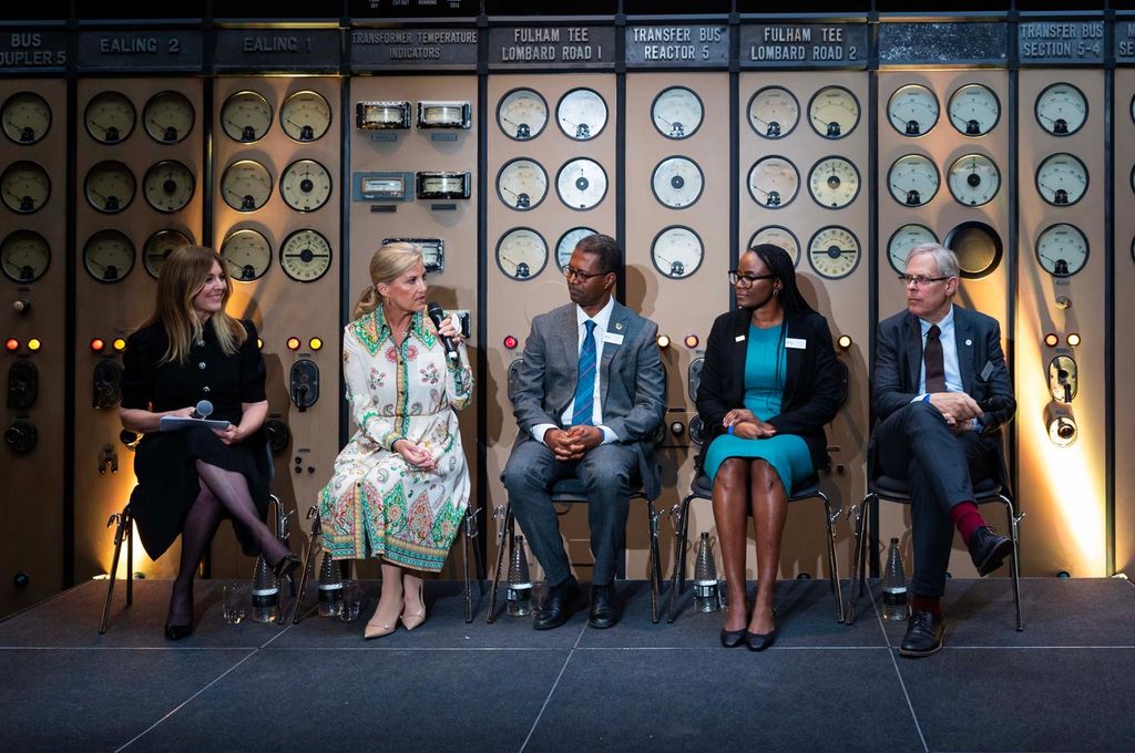 The Duchess of Edinburgh speaking into microphone on panel at Battersea Power Station