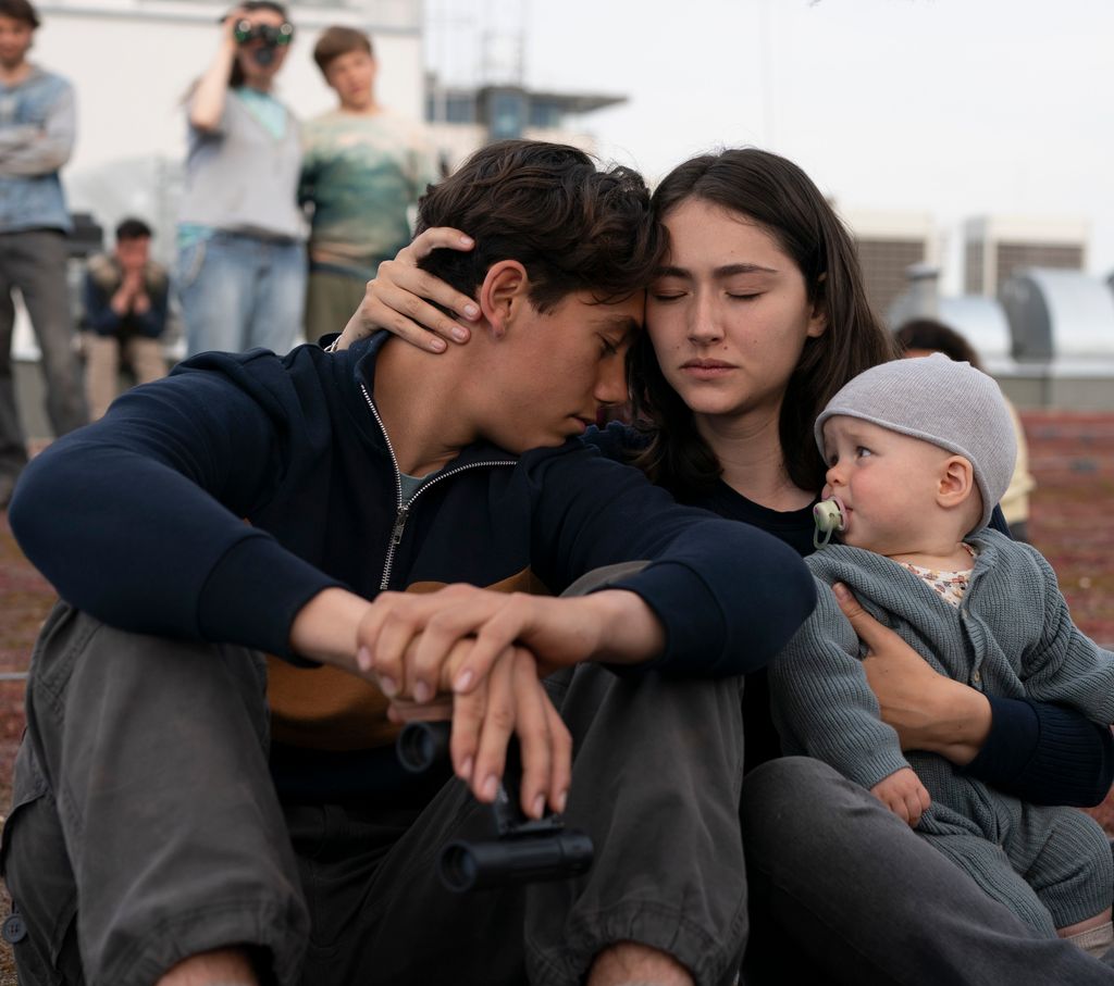 man and woman with baby