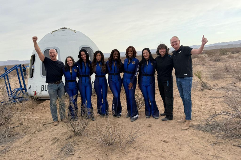 Blue Origin founder Jeff Bezos poses with (from left) film producer Kerianne Flynn, popstar Katy Perry, Lauren Sanchez (Jeff Bezos' fiancee), former NASA rocket scientist Aisha Bowe, journalist Gayle King, and bioastronautics researcher Amanda Nguyen, after the all-female crew landed in West Texas after Blue Origin completed its 11th human spaceflight 