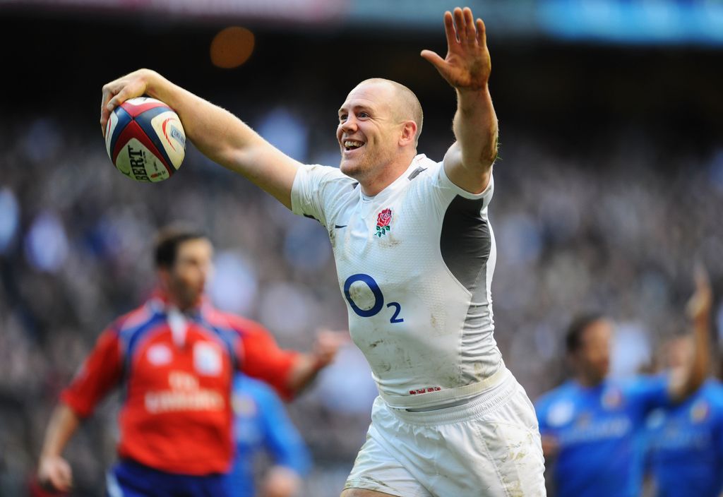 Mike Tindall holding a rugby ball