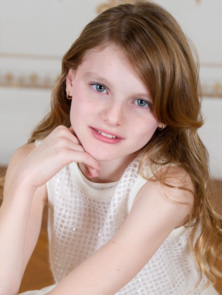 Princess Gabriella posed looking at camera in white dress