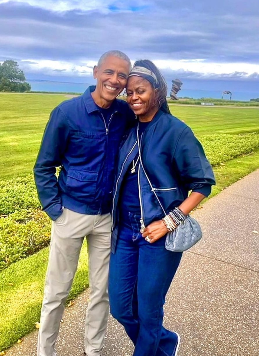 Barack and Michelle Obama outside hugging